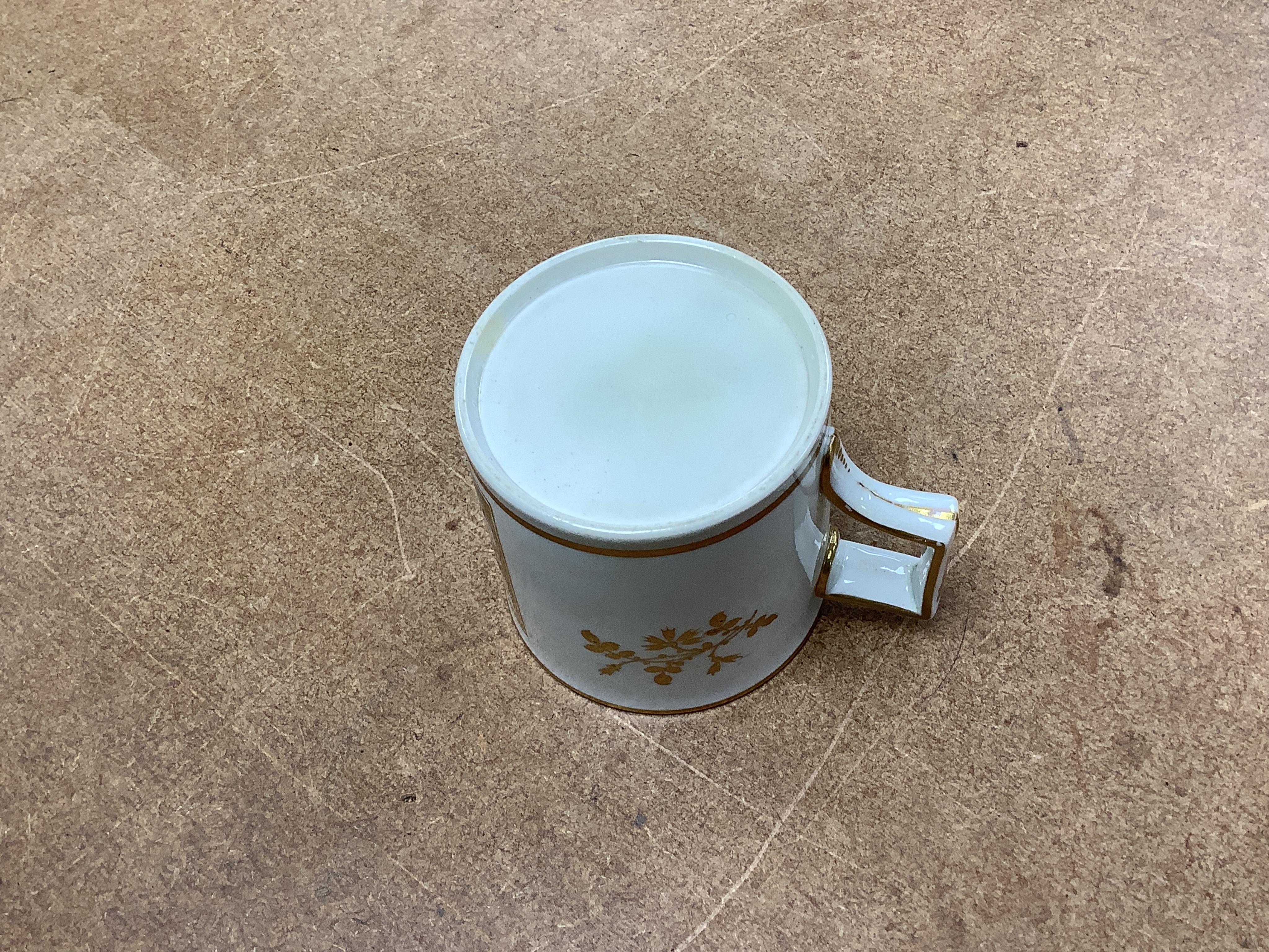 A pair of early 19th century English porcelain large mugs with gilt bands and five other early 19th century porcelain or pearlware mugs, one inscribed SG, Forget Me Not, largest each 14cm high